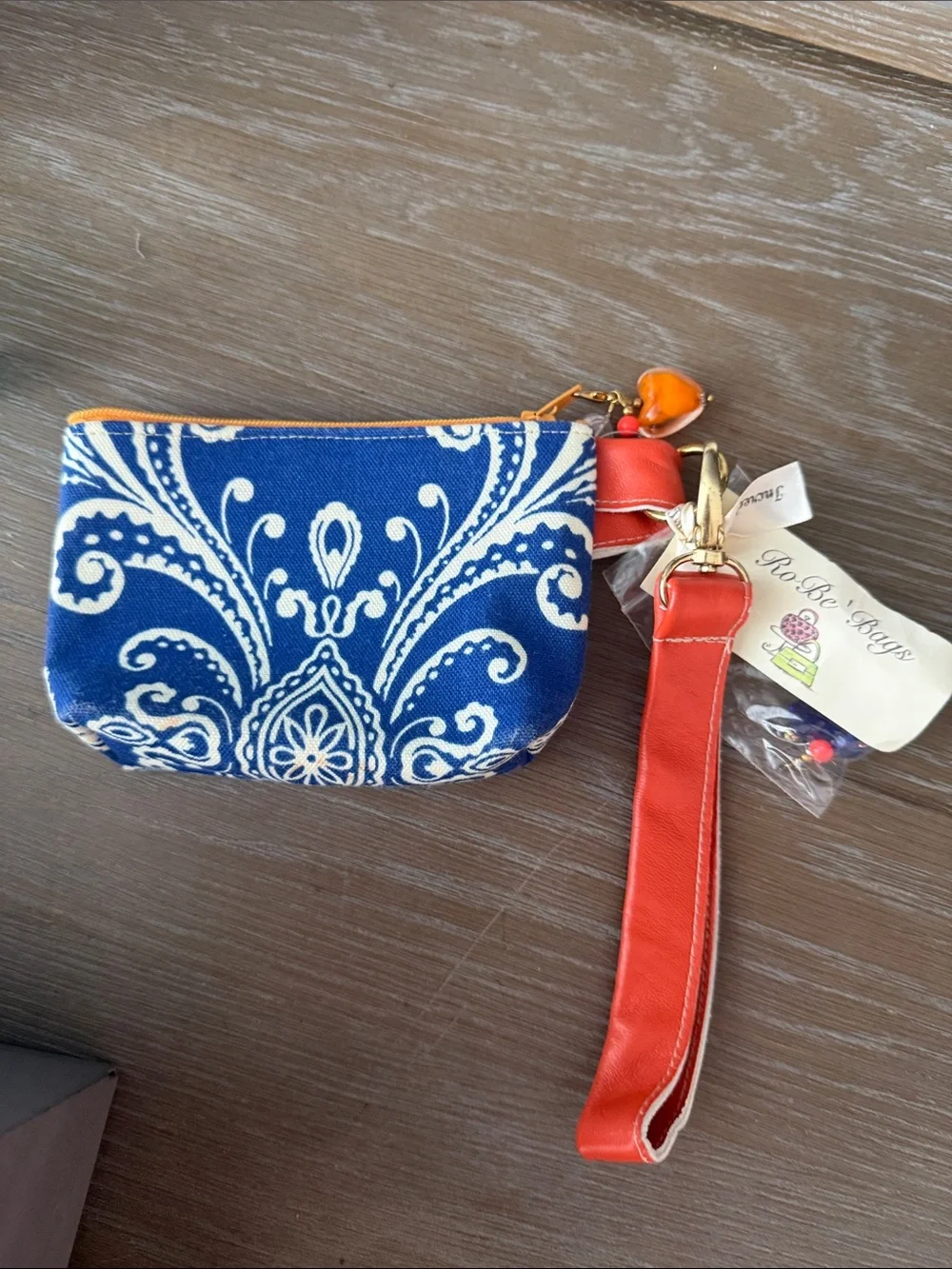 Orange and Blue Paisley ID/Cosmetic Pouch with wristlet sleeve.